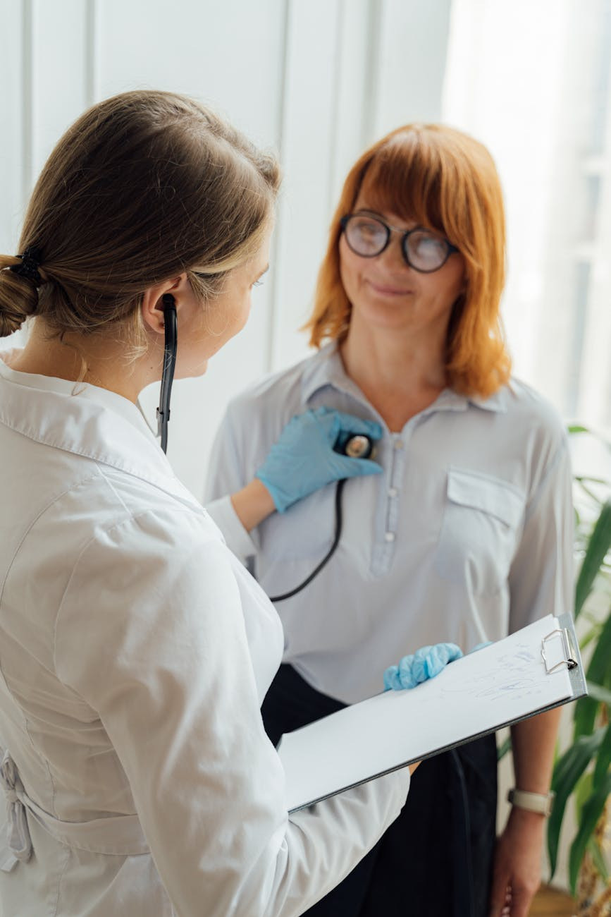 Family Doctor Talking With Senior Patient