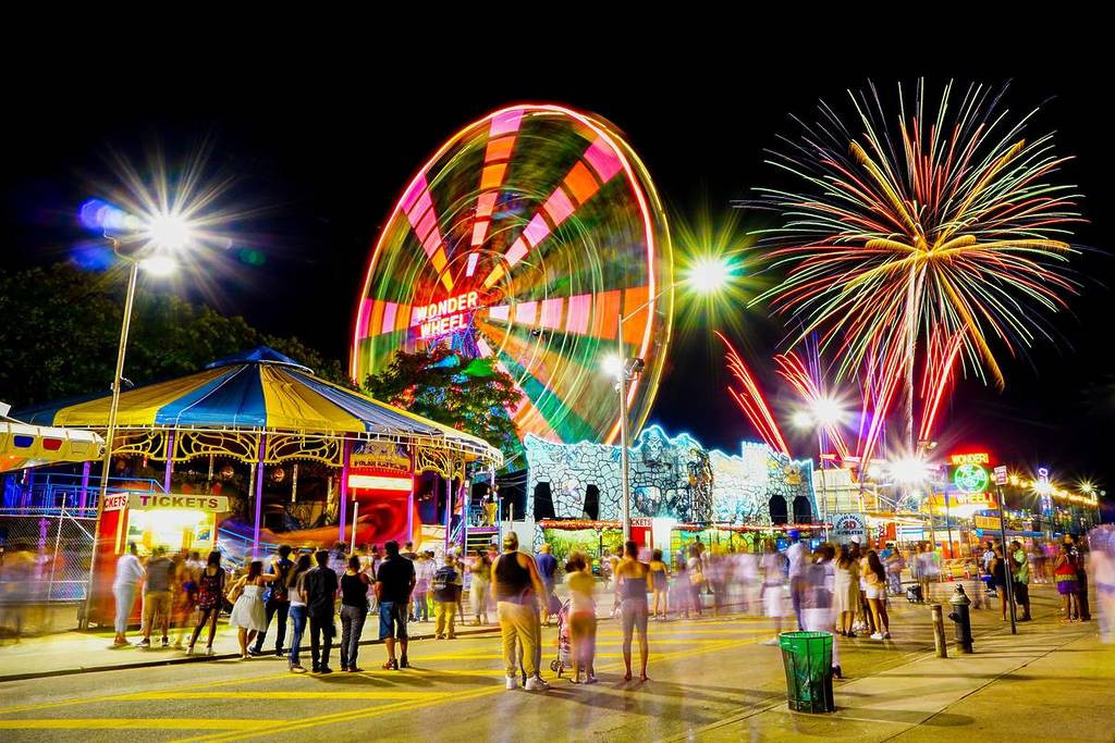 Crowd watches Fireworks over Coney Island, Brooklyn New York, USA