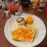 A vibrant spread of Mexican dishes including tacos, enchiladas, and guacamole, showcasing the colorful and flavorful cuisine often served at La Familia Mexican Restaurant, perfect for a family-friendly dining experience