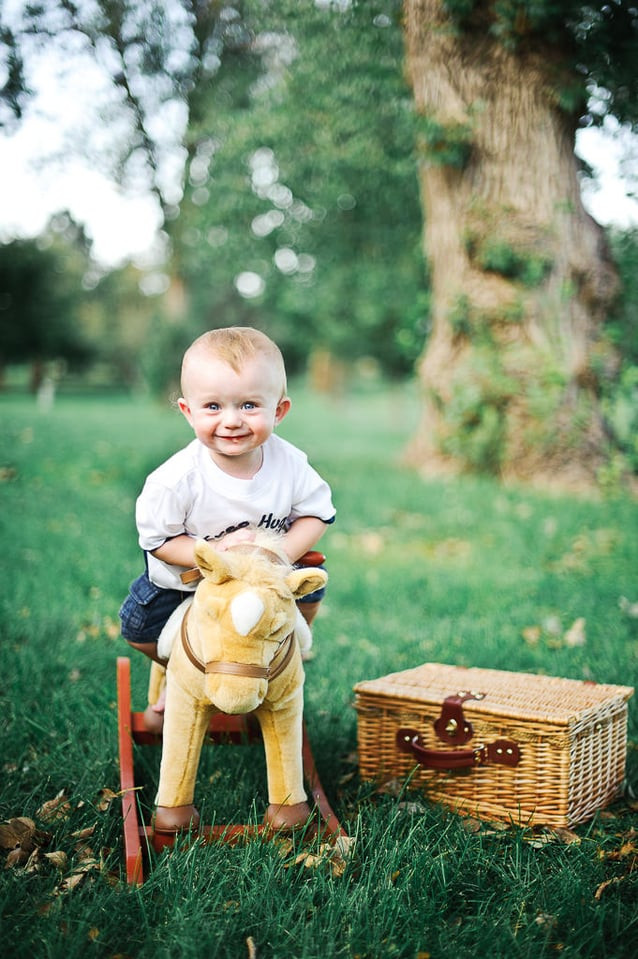 Family portrait setting with shaded areas and open spaces, ideal location for capturing joyful and natural family photographs
